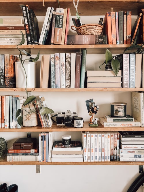 Photo of a bookshelf with many books on it